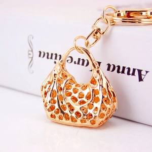 Exquisite gold alloy hollow handbag keychain with sparkling rhinestones for women
