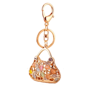 Porte-clés sac à main créatif avec strass colorés et pétales en métal doré