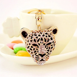 Porte-clés tête de léopard de luxe orné de strass brillants et finition dorée