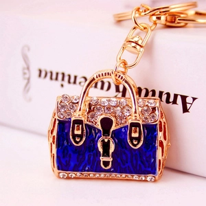 Golden handbag keychain with blue leopard enamel and crystal rhinestones