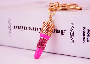 Detail of creative lipstick keychain with pink rhinestones and gold alloy lobster clasp