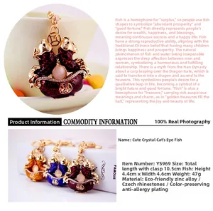 Close-up of Chinese carp keychain with rhinestones and fortune character details
