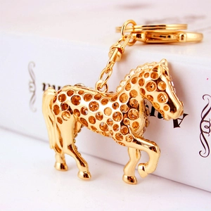 Golden zodiac horse keychain with hollow design and crystals for bags and keys