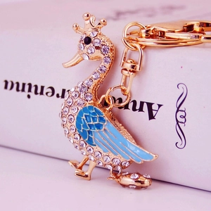 Creative gold swan keychain with blue enamel wings and sparkling crystal rhinestones