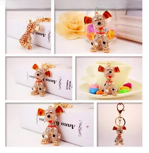 Detail view of cute spotted dog keychain with white rhinestones and enamel accents