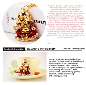 Macro shot of gold-plated Maitreya Buddha keychain with red enamel and Czech rhinestones