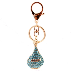Golden perfume bottle keychain with blue rhinestones and Parfum engraving for handbags