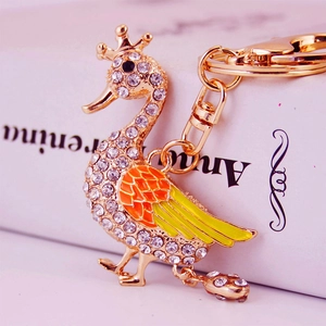 Creative crown swan keychain with sparkling rhinestones and colorful enamel on a book