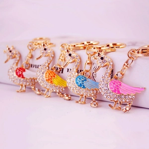 Set of creative swan keychains with colorful wings and crystals in four vibrant colors