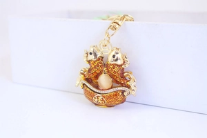 Detailed macro view of the lucky carp bowl keychain with red koi and opal bead