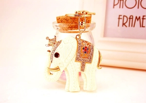 Detailed close-up of elephant keychain with golden crown and crystal saddle embellishments
