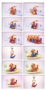 Detail showing various colors of rhinestone zodiac dragon keychains with lobster clasps