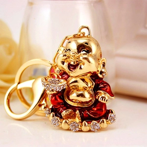 Golden Laughing Buddha keychain with red enamel and crystals, traditional Chinese lucky charm