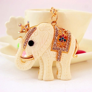 Cute white resin elephant keychain with golden crown and colorful rhinestones
