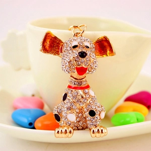 Cartoon Dalmatian keychain with gold alloy frame and sparkling white crystals on a coffee cup
