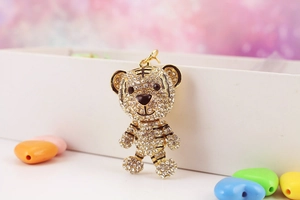 Detail of cute tiger keychain with sparkling rhinestones and gold-plated metal base