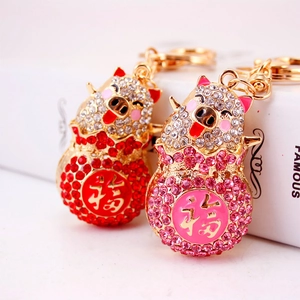 Sparkly crystal pig keychains with gold finish and lucky Fu character for women handbags