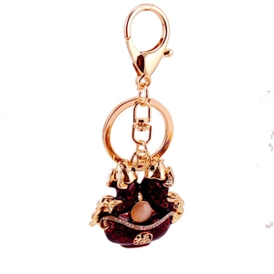 Golden double koi fish keychain with red lucky basin and sparkling rhinestone accents