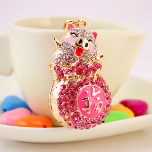 Sparkling crystal pig zodiac keychain with pink rhinestone details and gold finish