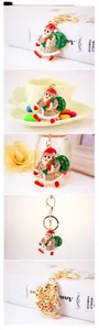 Macro view of Santa Claus keychain with colorful oil drip process and white rhinestones