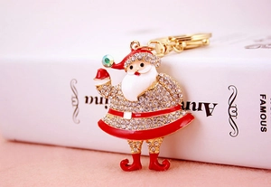 Detailed macro view of rhinestone Santa Claus keychain with golden spring D-clasp