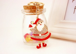 Detail of Santa Claus keychain with sparkling rhinestones and red enamel finish