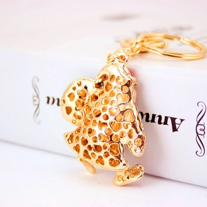 Golden cartoon hollow-out metal keychain with heart textures for bags and car keys