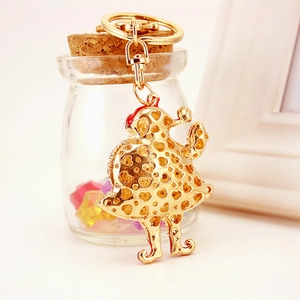 Sparkling gold cartoon Santa keychain with rhinestone heart cutouts and gift packaging