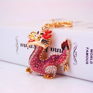 Chinese zodiac dragon keychain with pink rhinestones and gold-plated metal finish