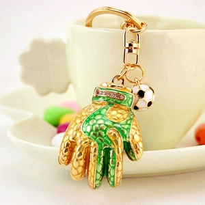 Soccer keychain featuring a green goalkeeper glove with rhinestones and a ball pendant
