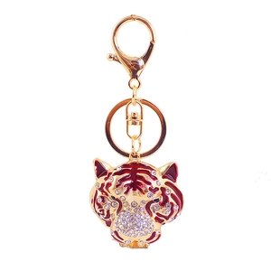Porte-clés tête de tigre en alliage doré avec strass blancs et détails en émail rouge