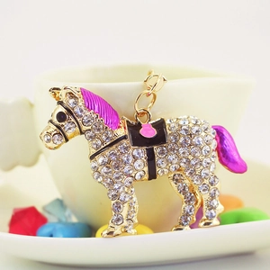 Exquisite horse keychain with sparkling rhinestones and rose red accents on a gold base