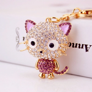 Sparkling crystal cat keychain with purple and clear rhinestones on gold metal base