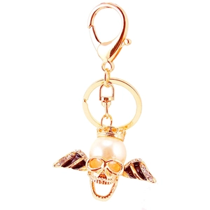 Gothic skull keychain with wings, crown and white pearl in gold-plated finish with rhinestones