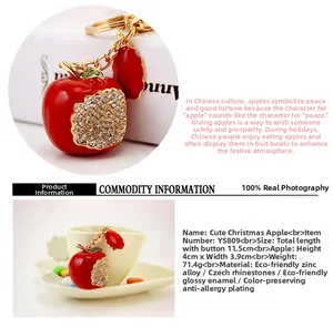 Close-up of red apple keychain with sparkling crystals and golden ring detail