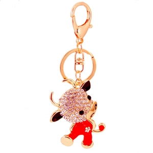 Cartoon zodiac ox keychain in gold alloy with white rhinestones and red enamel coating