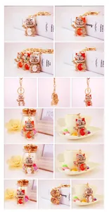 Detail view of lucky cat keychain with crystal rhinestones and golden metal finish