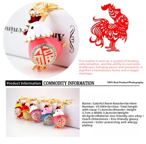 Detail view of five colorful resin rooster keychains with sparkling Czech rhinestones