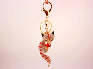 Detail of crystal rhinestone fox keychain with gold alloy finish and lobster clasp