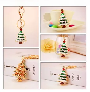 Detailed views of a gold Christmas tree keychain with green enamel and colorful rhinestones