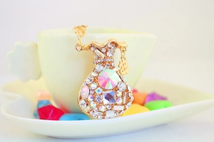 Detail of money bag keychain with colorful crystals and dollar sign pendant accessory