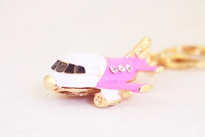 Close-up of pink A380 airplane keychain with sparkling rhinestones and gold plating
