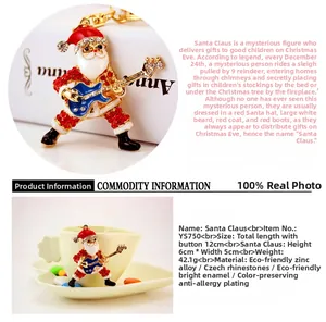 Detail of Santa Claus keychain with red enamel and blue Czech rhinestones on zinc alloy