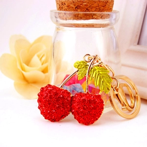 Sparkling cherry keychain with red rhinestones and golden hardware for bags and car keys