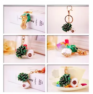 Detailed views of a creative Chinese cabbage keychain featuring lucky charm and red seal