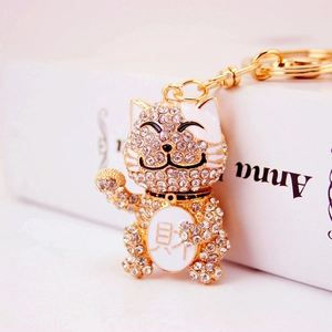 Sparkling crystal lucky cat keychain in gold metal finish with lucky charm detail