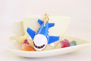 Detailed close-up of a blue and white A380 airplane model keychain with sparkling rhinestones