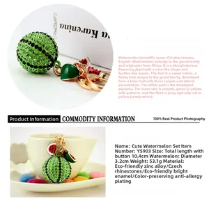 Close-up of cute watermelon keychain with green rhinestones and zinc alloy detail