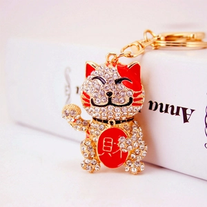 Sparkly Chinese Lucky Cat keychain with golden alloy and white crystal rhinestones