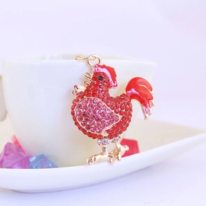 Sparkling rooster keychain with red and pink crystals on gold-tone metal frame